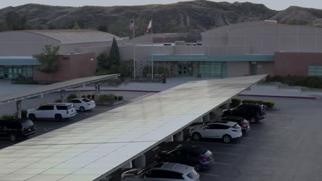 aerial, rising, drone shot, over la mesa junior high school, at sunset, in santa clarita, california, usa