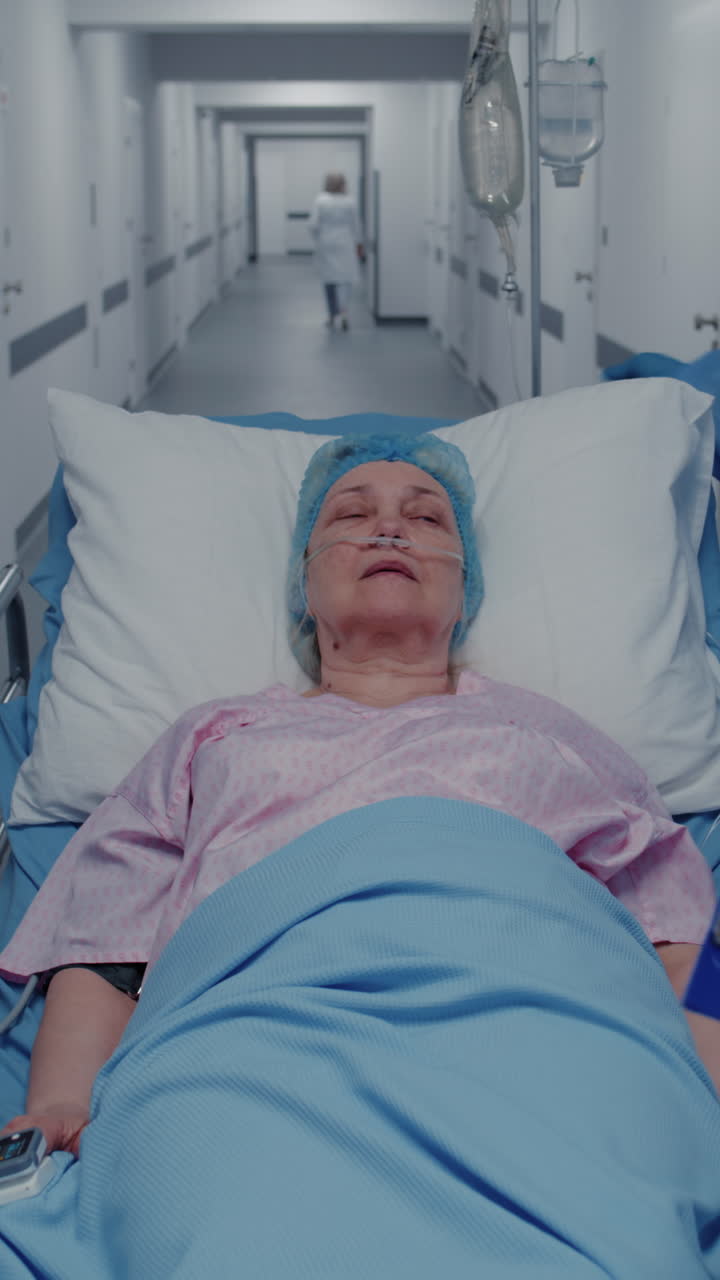 Doctors examine ill woman in clinic corridor 4k 2025 07 22 07 44 20 utc.mov | african american, aged, assistance, care