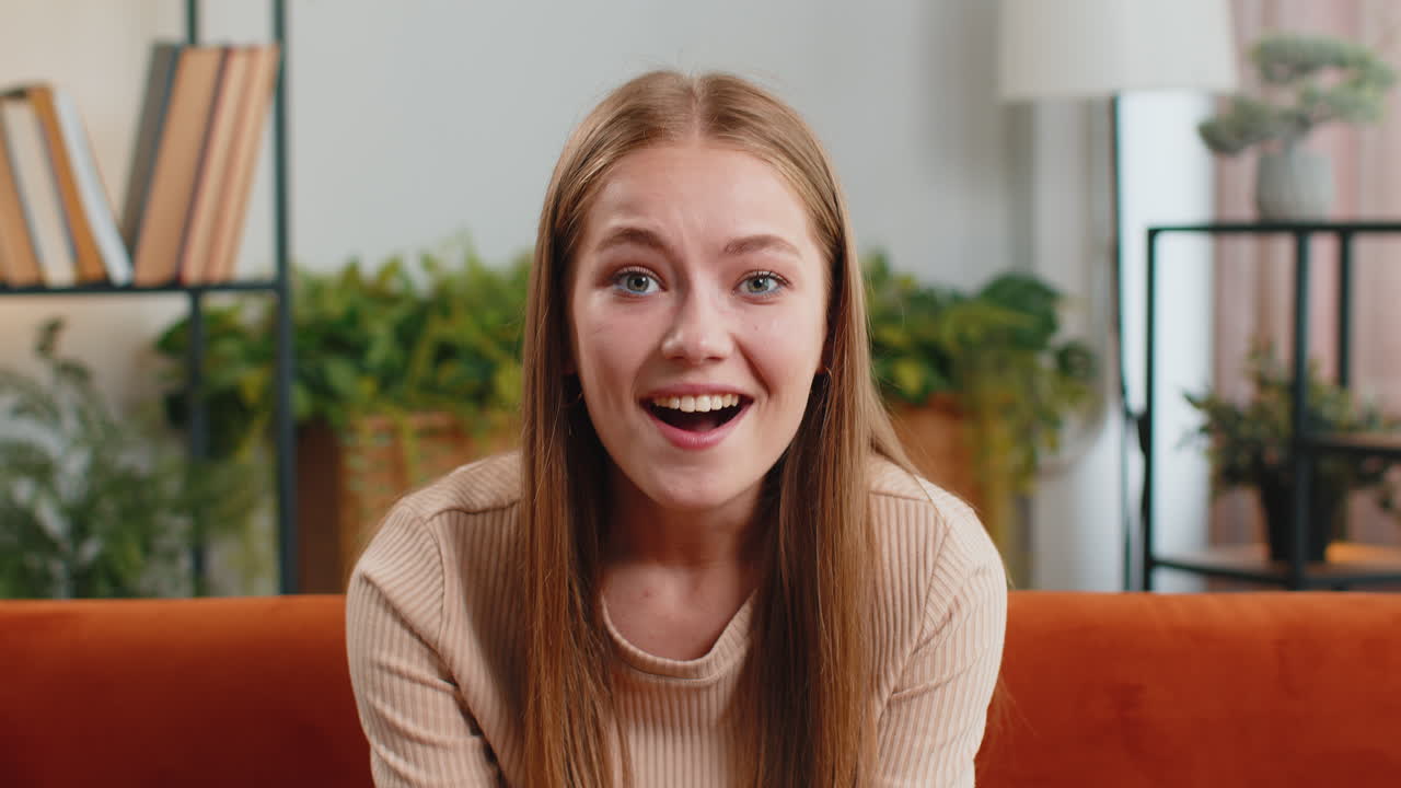 Excited happy woman surprised, shocked by sudden victory, good win news, celebrating, wow reaction
