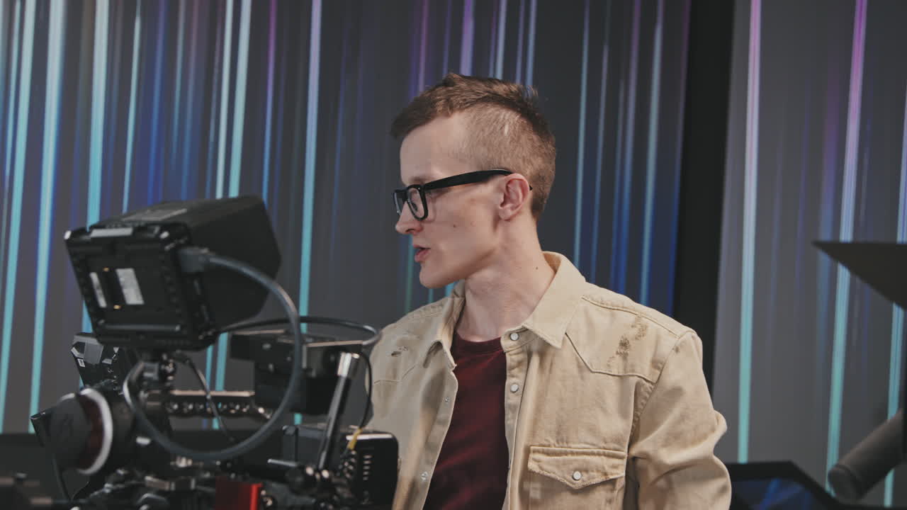 Male Operator Giving Instructions On Walkie-Talkie During Shooting