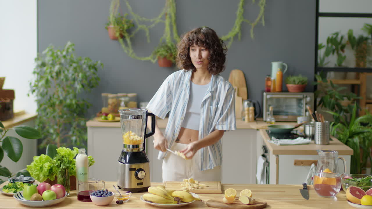 Food Blogger Preparing Fruit Smoothie and Talking on Camera