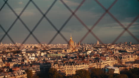 paris skyline view through a fence