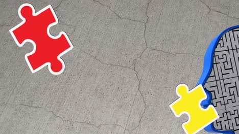 animation of green, yellow and red puzzle pieces falling over model of human head on grey background