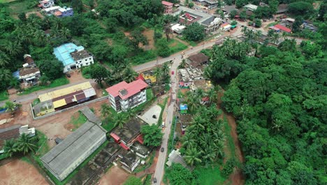aerial flying over traffic in the suburb of chikmagalur, india