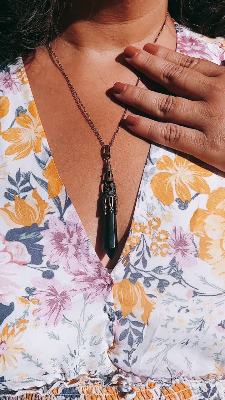 Woman wearing a crystal necklace