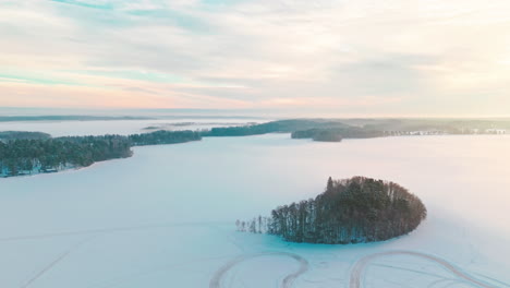 a small island or isle in middle of a frozen lake or sea ice engulfed in fog or mist