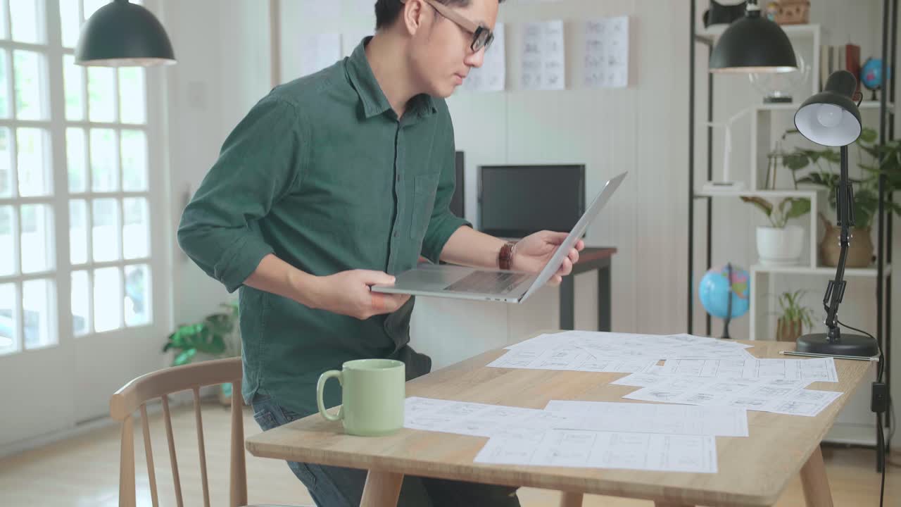 Asian Man Works With Laptop Computer And Storyboard. Stand Up And Walking Out Frame, Comics Compilation, Application Ui Or Game Plot