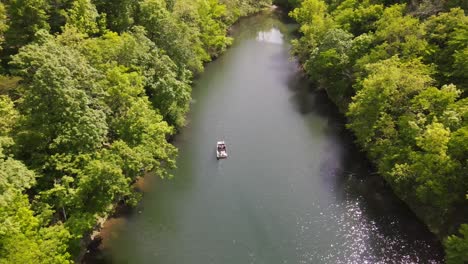 This-is-a-beautiful-Aerial-Top-down-shot-of-a-boat-on-a-private-lake-cruising-on-a-clear-sunny-day