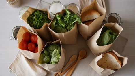 fresh groceries in sustainable paper bags
