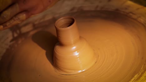 potter at work makes ceramic dishes. india, rajasthan.