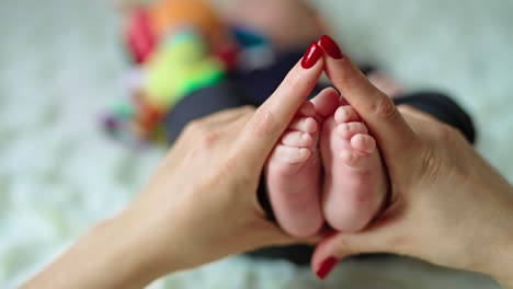 lovingly holding baby feet
