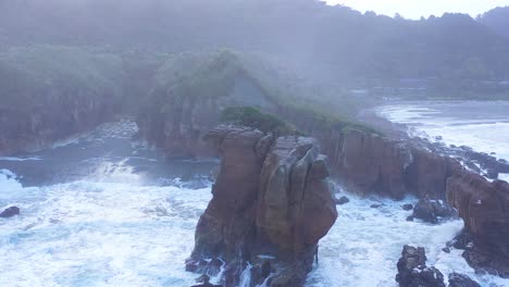 aerial around the pancake rocks geological formations on the coast of south island of new zealand