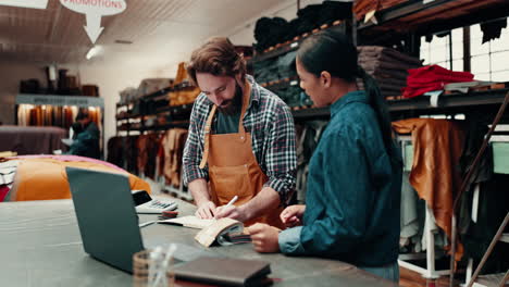 man, woman and talking in textile warehouse