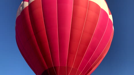 closeup of hot air balloon in flight, burner on