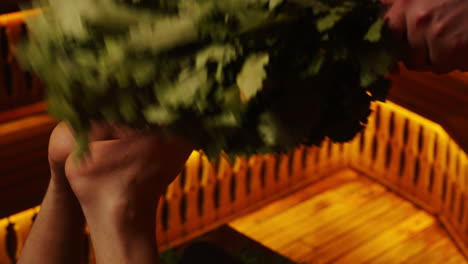 sauna feet treatment with herbal broom