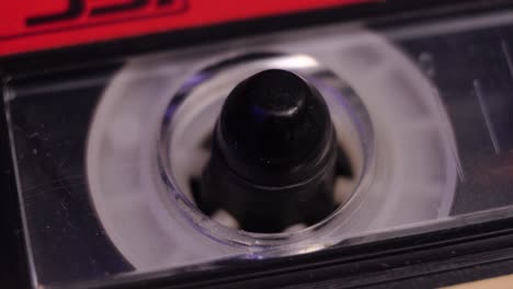 audio cassette tape close up, playing analog recording in vintage player