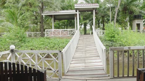 pov view walking through the riverhouse towards the bridge enterence