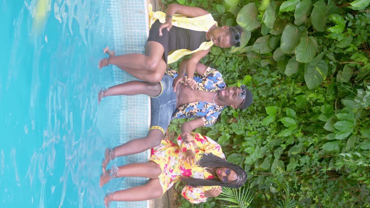 Pals Relaxing by the Swimming Pool in Africa - Vertical Shot