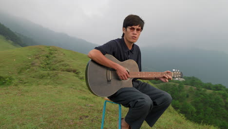 young musician playing guitar