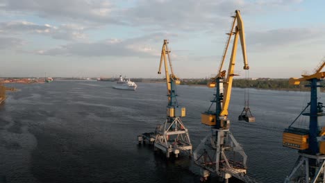 cruise ship leaving industrial port