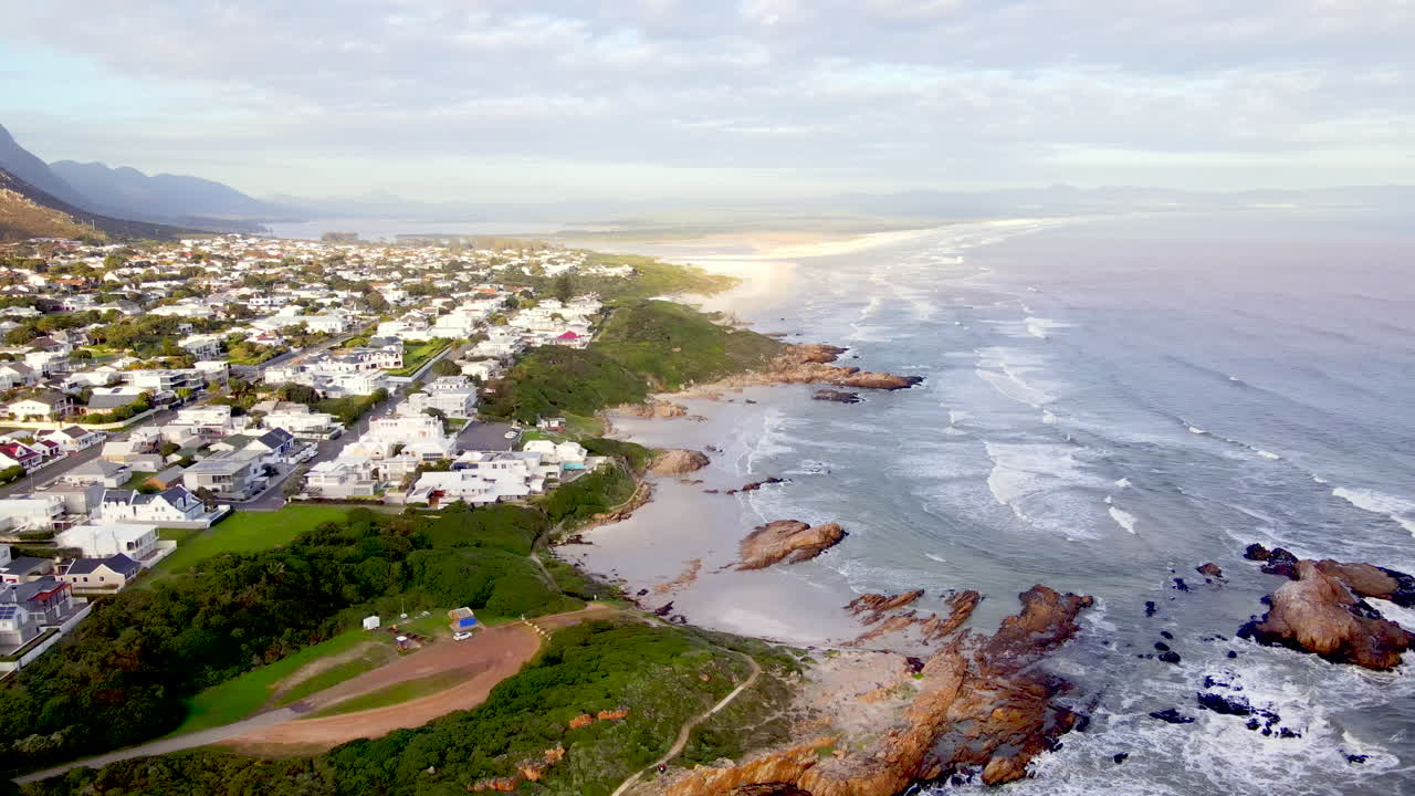 Drone flight over scenic Hermanus Voëlklip coastline with its beaches
