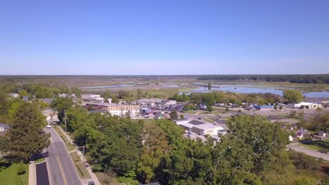 forward panning aerial of church tower and town of montague, michigan