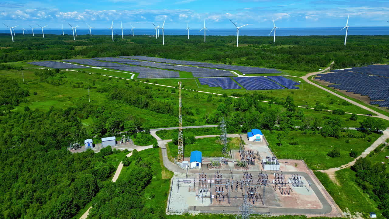 Aerial View of a Combined Solar and Wind Energy Farm with Substation