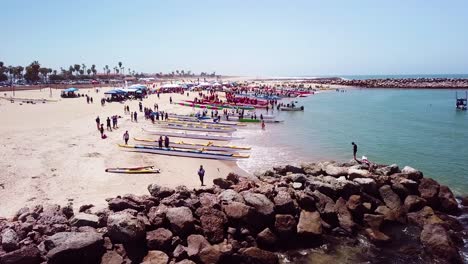 Vista-Aérea-over-outrigger-canoes-on-a-beach-during-a-rowing-race-on-the-Pacific-ocean-near-Ventura-California-1