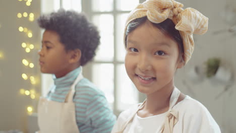 Portrait-of-Cheerful-Asian-Girl-on-Culinary-Masterclass