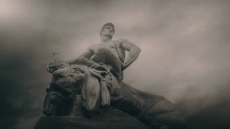 epic, ancient stone statue on cloudy day and windy weather.