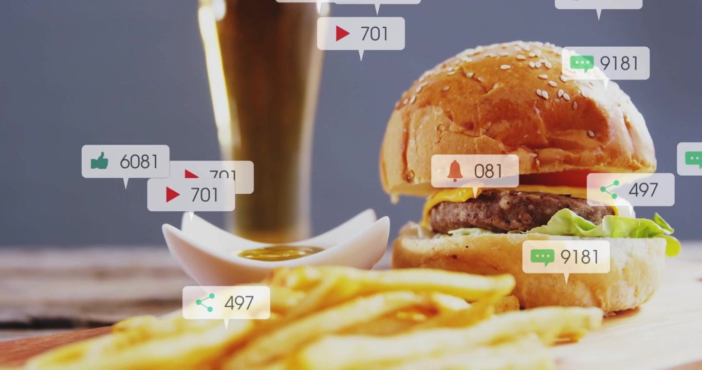 Burger, fries, beer on wood table, social bubbles growing, hiding burger as counters rising, promo