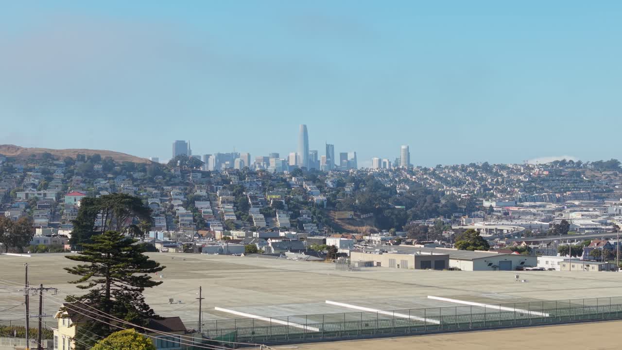 A static elevated perspective shows Bernal’s patchwork of yards, gardens, and homes.