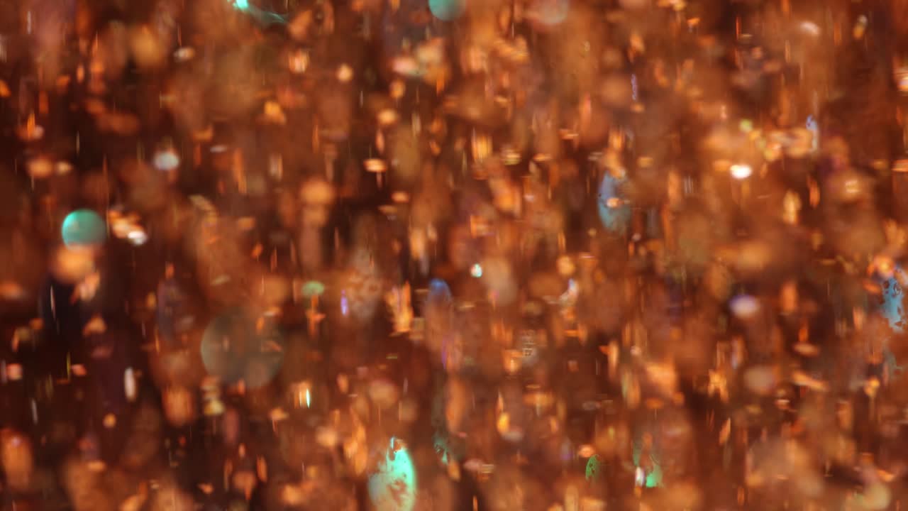 Abstract Orange and Gold Sparkle Background with Bokeh Lights