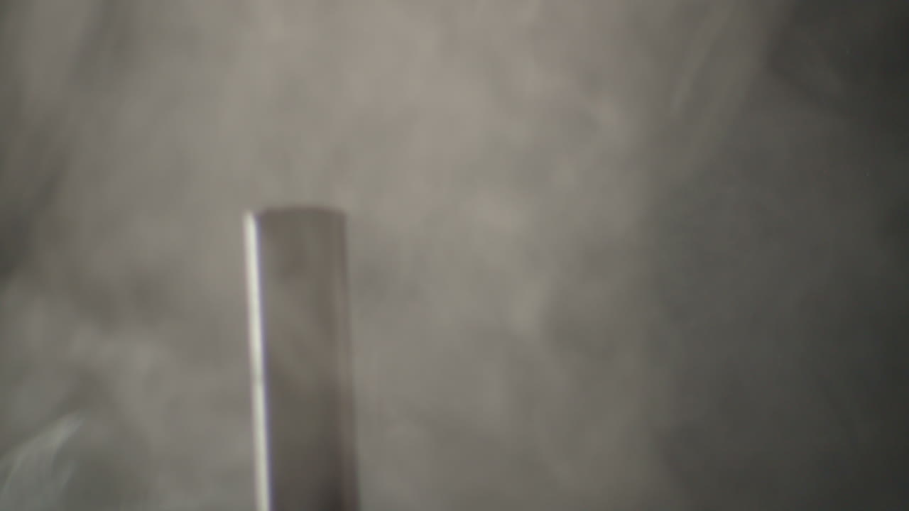 Hammer hitting a big nail in a dramatic misty ambience