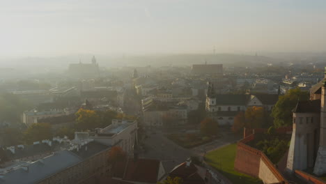 Foggy,-autumn-morning-over-Old-Town,-Kazimierz-and-Stradom-district-in-Krakow