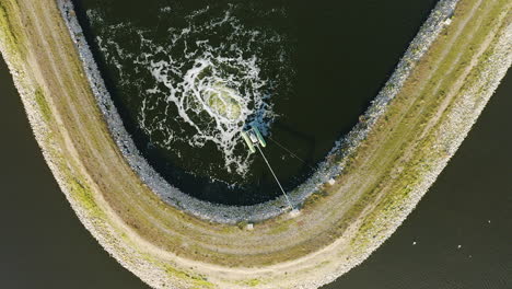 water treatment pond from above aerial view slow motion bubbles of water