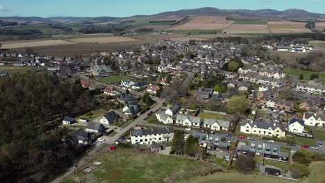 Aerial-view-of-the-Scottish-town-of-Edzell-on-a-sunny-spring-day,-Angus,-Scotland