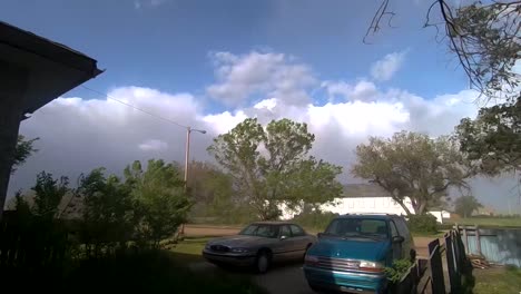 front yard of a home in the country during a storm.  taken during the day in empress alberta canada.