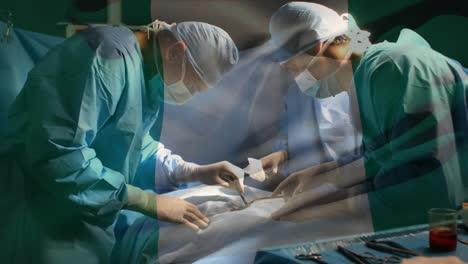 animation of flag of nigeria waving over surgeons in operating theatre