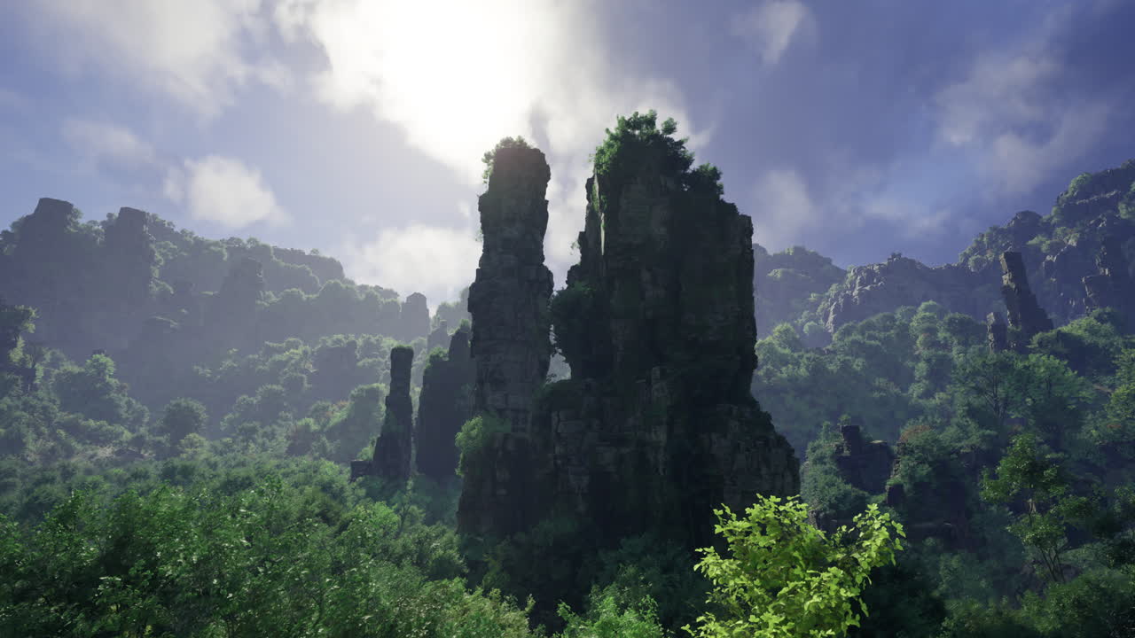 Towering rock formations surrounded by lush greenery and bright sky
