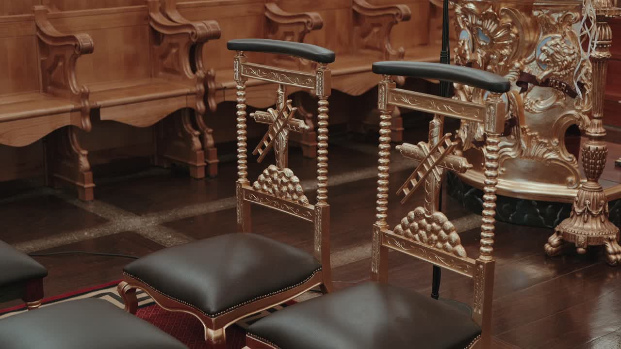 Luxurious golden chairs adorn majestic hall with elegance