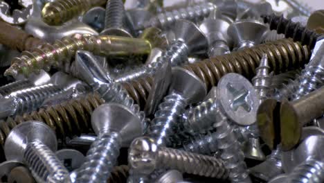 pile of old and new screws close up