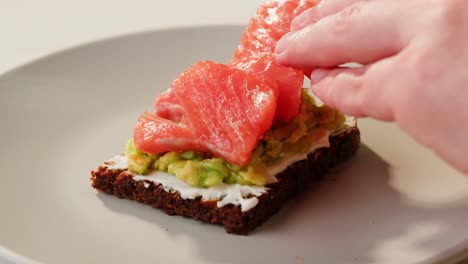 making a salmon avocado toast