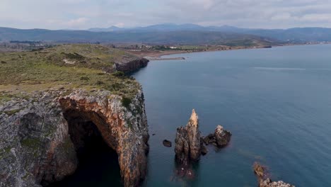 aerial view over jagged cliffs and rugged coastline on evia island, greece