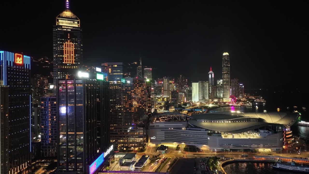 Night view of skyscrapers of Hong Kong at busy hours. Aerial.