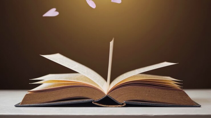 Un libro aperto con i cuori volanti