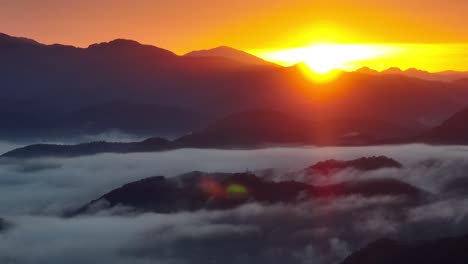 breautiful sunrise above the flowing fog