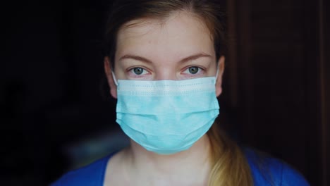 woman putting on a medical disposable mask to avoid contagious viruses 02