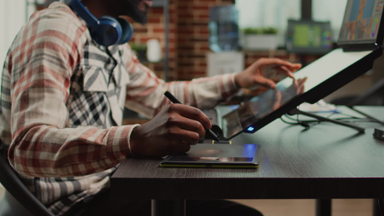 Male photographer working on image editing with retouching software