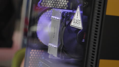 the inside of an illuminated gaming pc case in slow motion